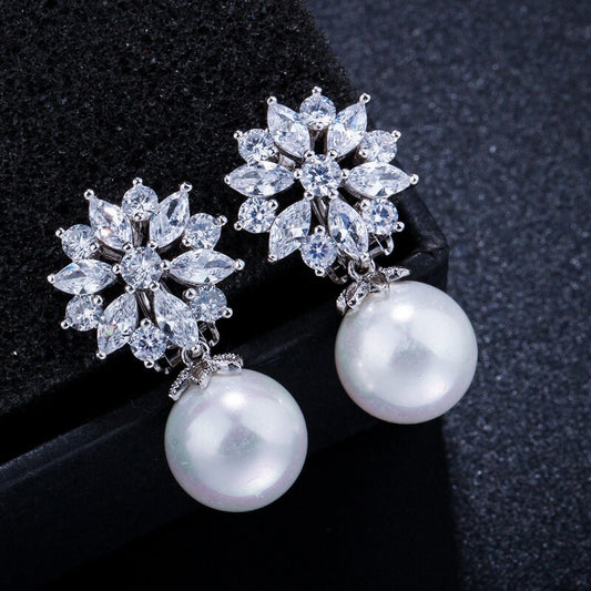 SUNNEE CRYSTAL AND SIMULATED PEARL CLIP ON EARRINGS